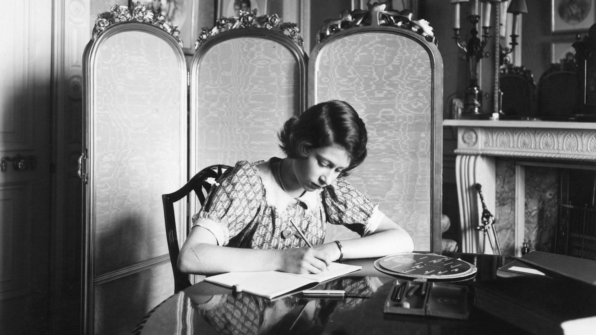 June 22, 1940: Princess Elizabeth working on her studies at a desk in Windsor Castle. 