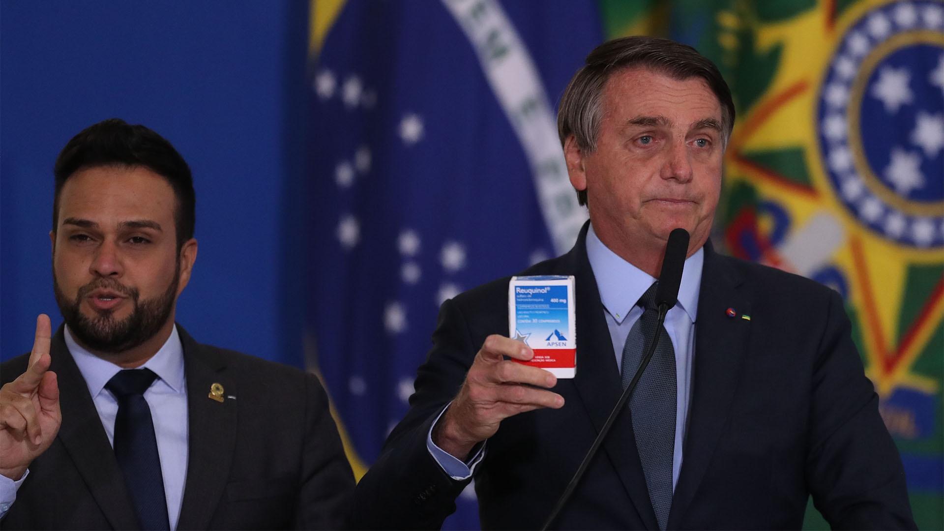 President Jair Bolsonaro shows a box of Hydroxychloroquine.