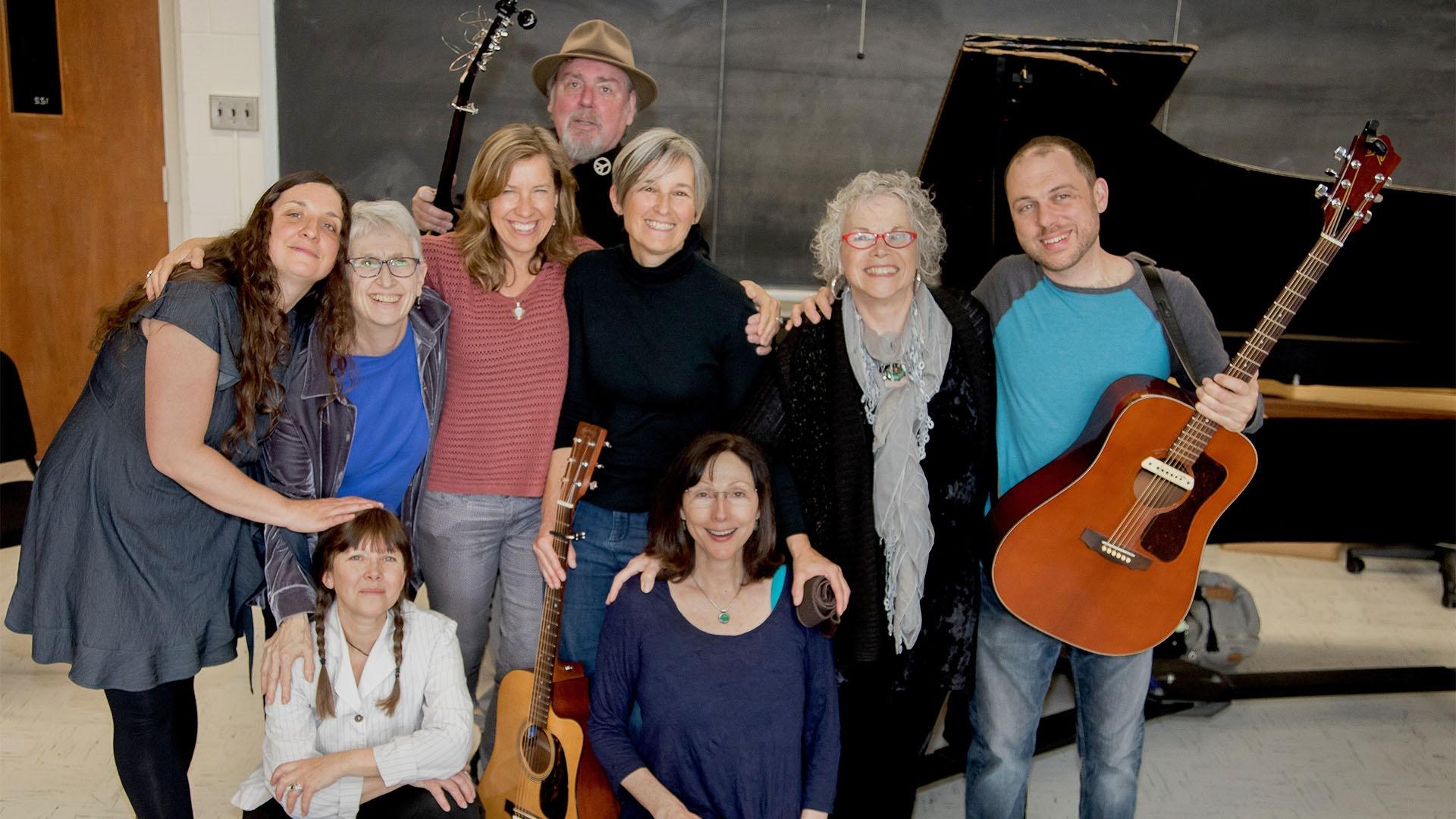 Songwriters pose backstage prior to their concert honoring the lives of Holocaust survivors.