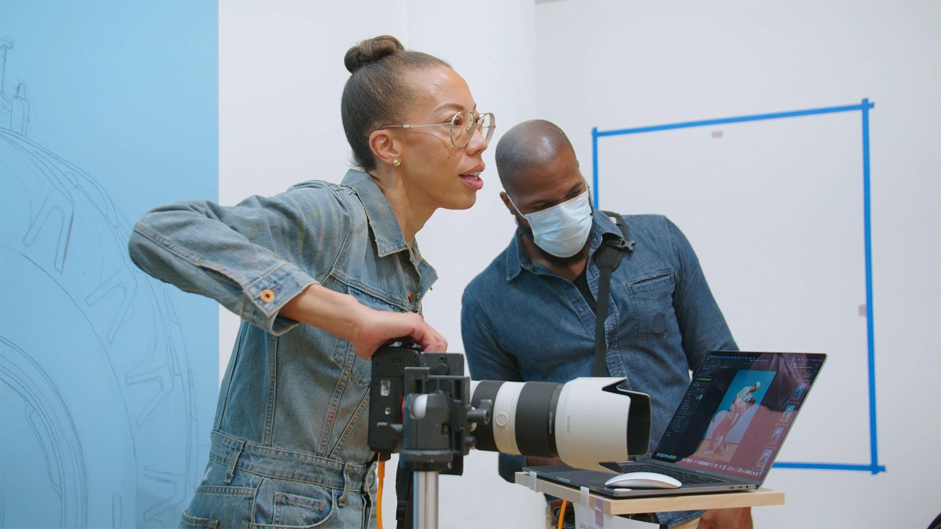 Production still of Amy Sherald photographing models in her Jersey City studio.