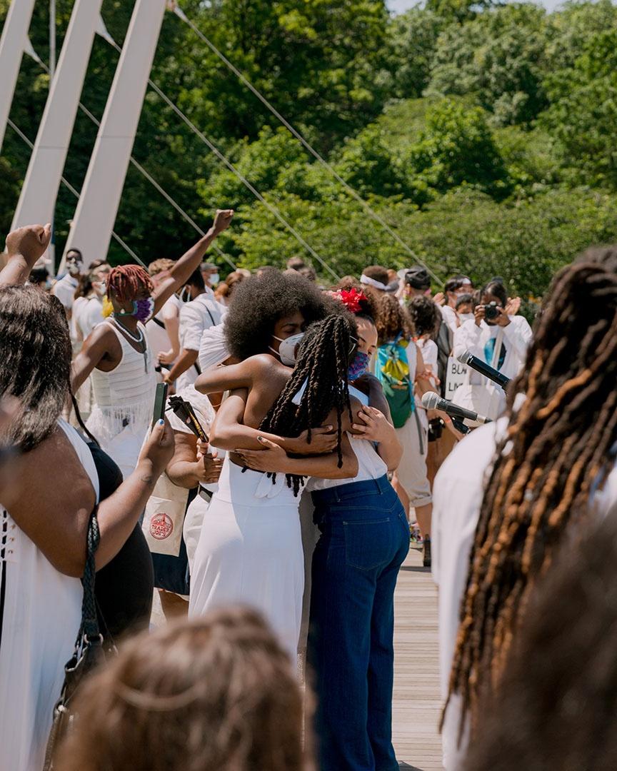 Women embrace during a rally in support of Black Trans Lives.