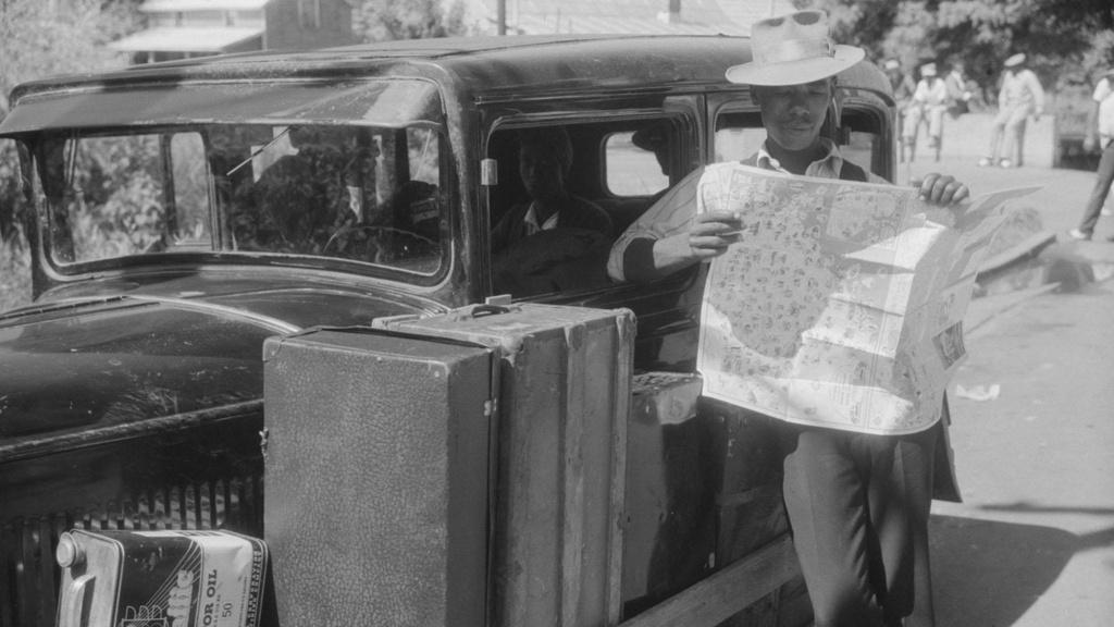 Granville Clarke, Florida migratory agricultural worker studying a road map.
