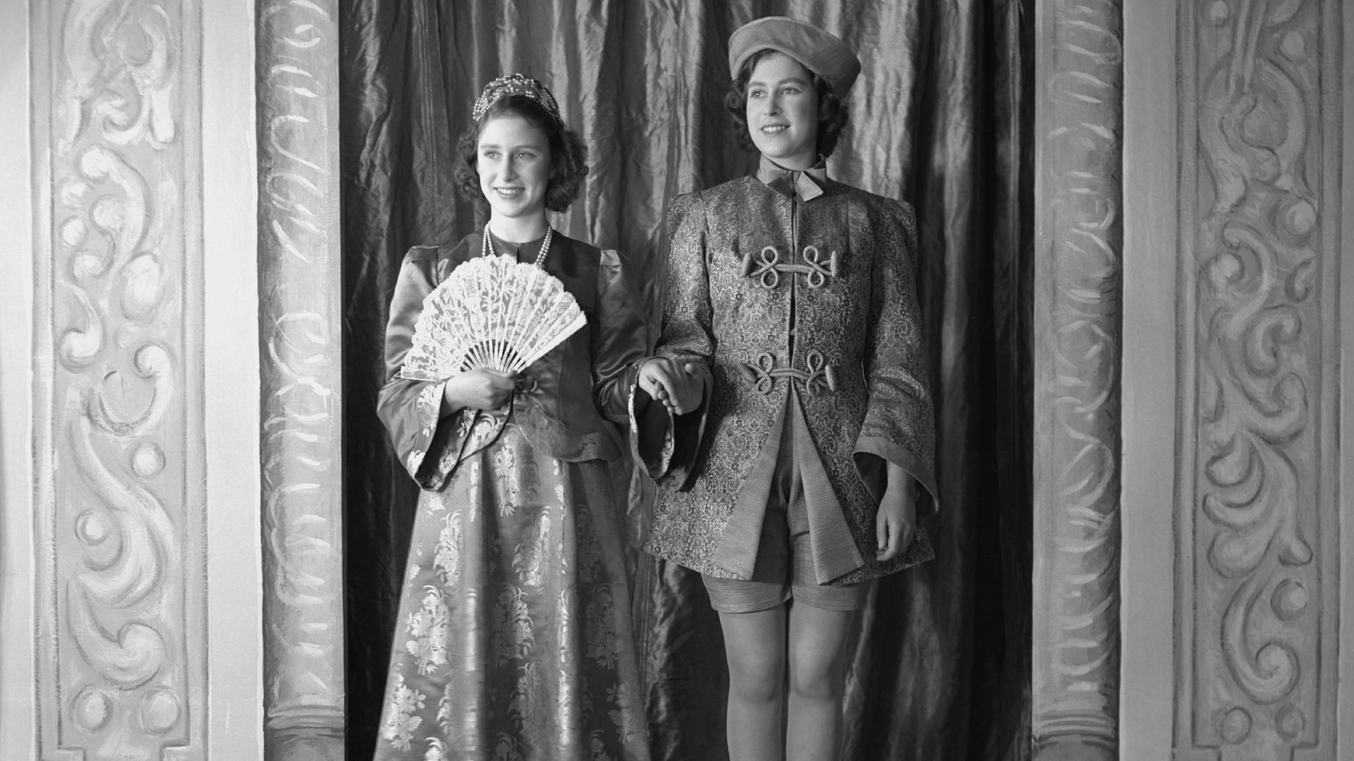 Princess Margaret (1930-2002) and Princess Elizabeth (Queen Elizabeth II), both in costume.