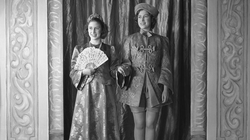 Princess Margaret (1930-2002) and Princess Elizabeth (Queen Elizabeth II), both in costume.