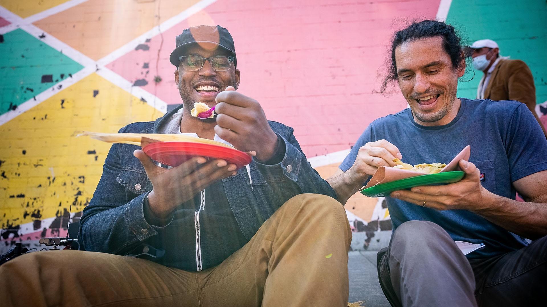 Host Shane and Director Nate eat a tamale in the streets of Mexico City.