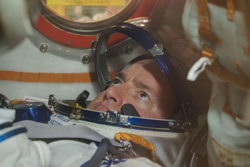 Scott Kelly inside the Soyuz TMA-16M spacecraft during the fit check.