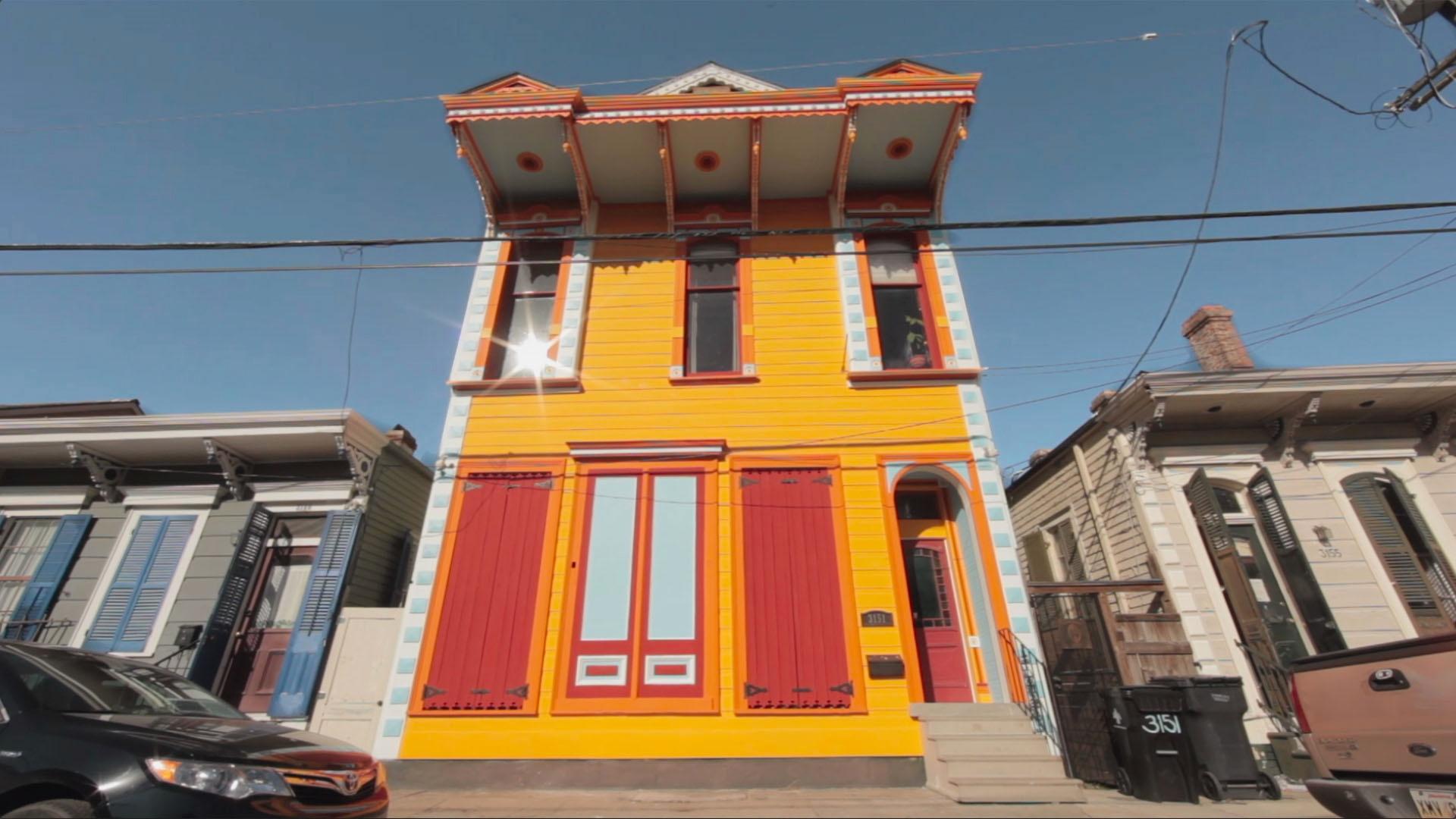 Still image of vibrantly colored house in New Orleans