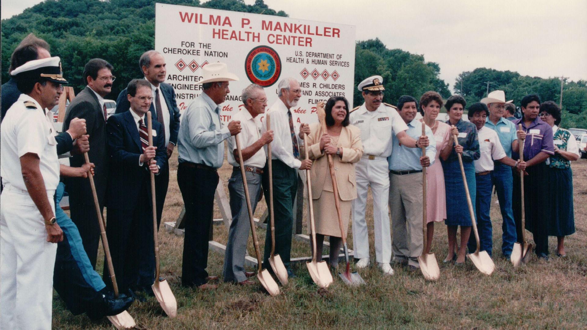 Wilma Mankiller and colleagues hold ceremonial shovels.
