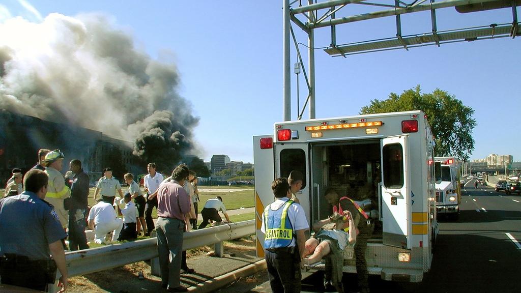 First responders load the injured into ambulances.