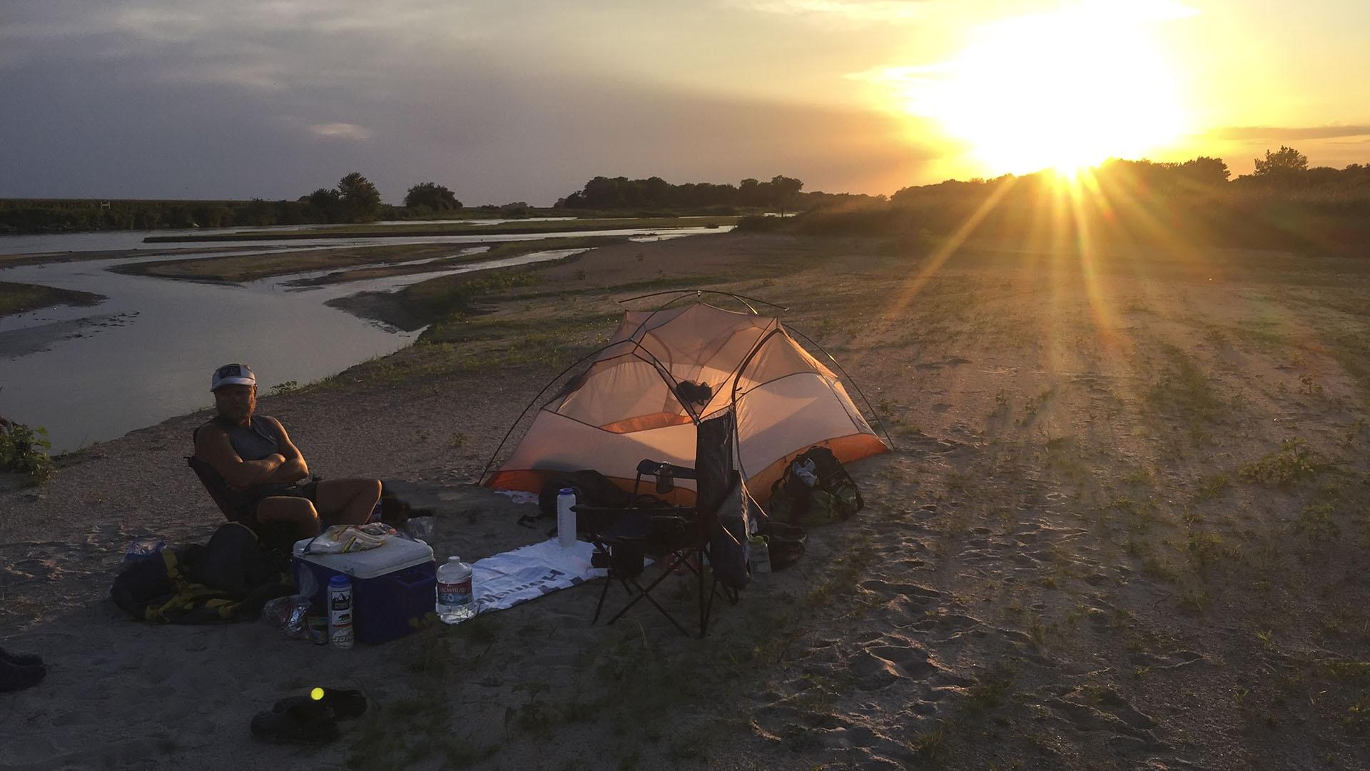 Peter Stegen camping by the Platte River.