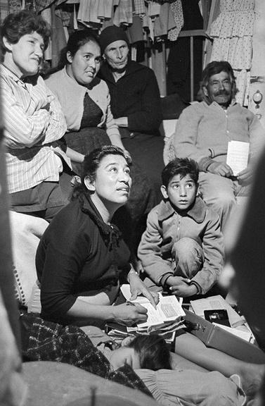 Image of Maria Moreno surrounded by farm workerss