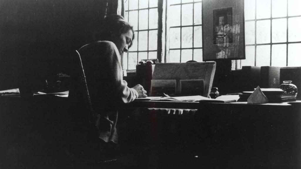 Anne Morrow Lindbergh writing in a study at Long Barn, England, 1936.