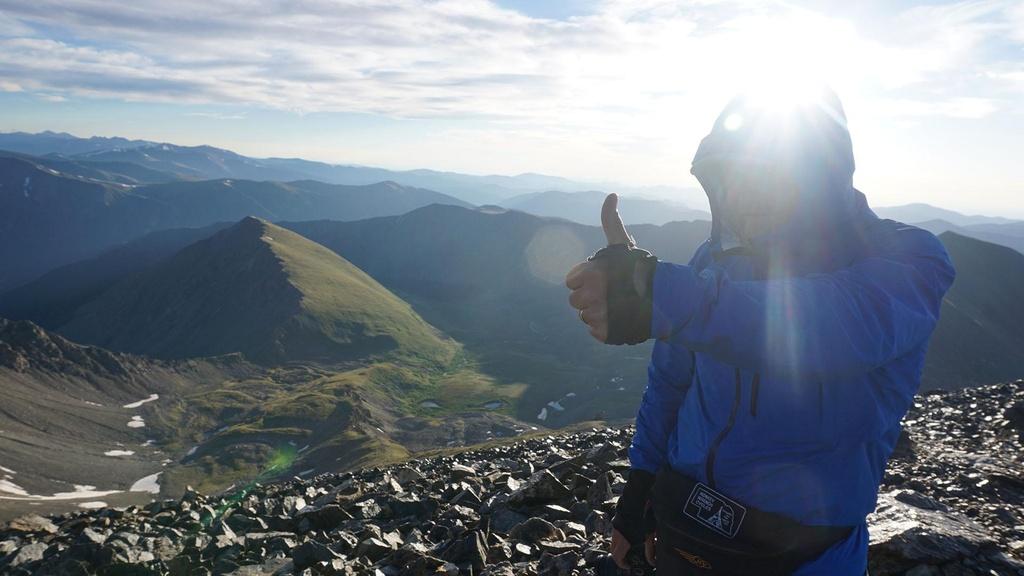 Peter Stegen standing at the summit of Grays Peak.