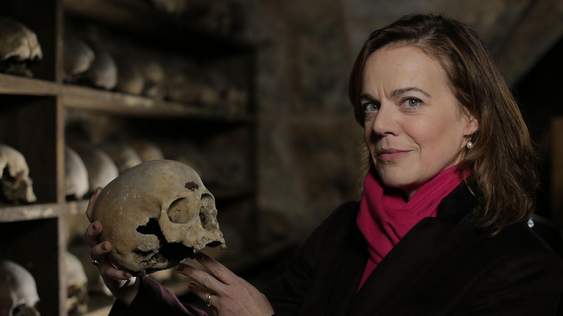 Host Helen Castor in a bone crypt at Holy Trinity Church, Rothwell.