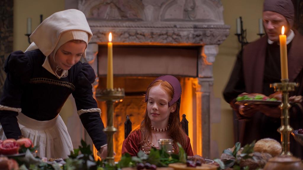 Image of Lucy Worsley, dressed as a maid