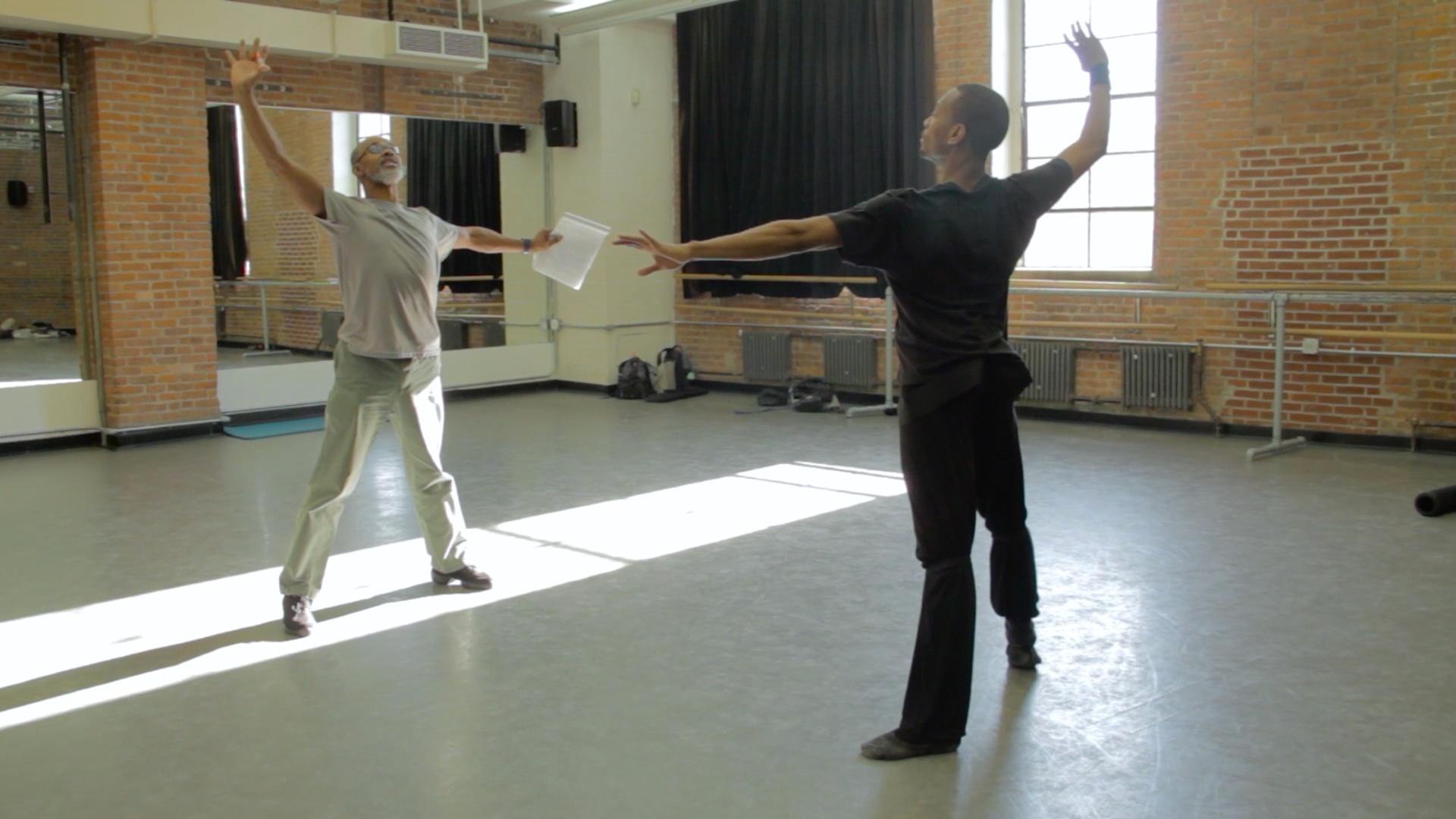 Fredrick Davis receives instruction from Ballet Master Keith Saunders.
