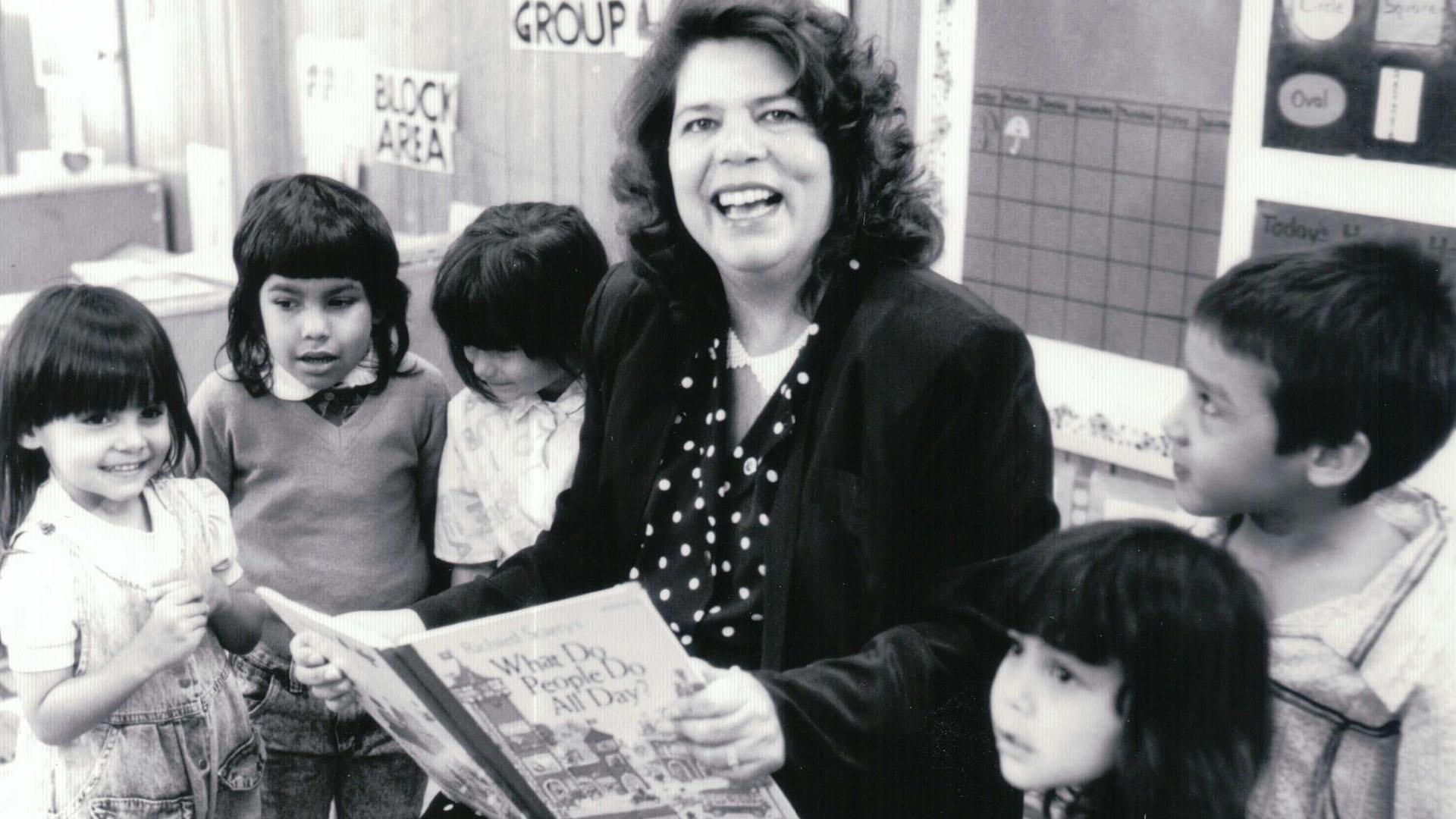 Wilma Mankiller reads to young students.