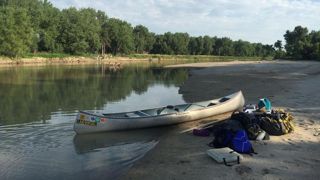 Canoe sitting on a bank of the North Platte River.