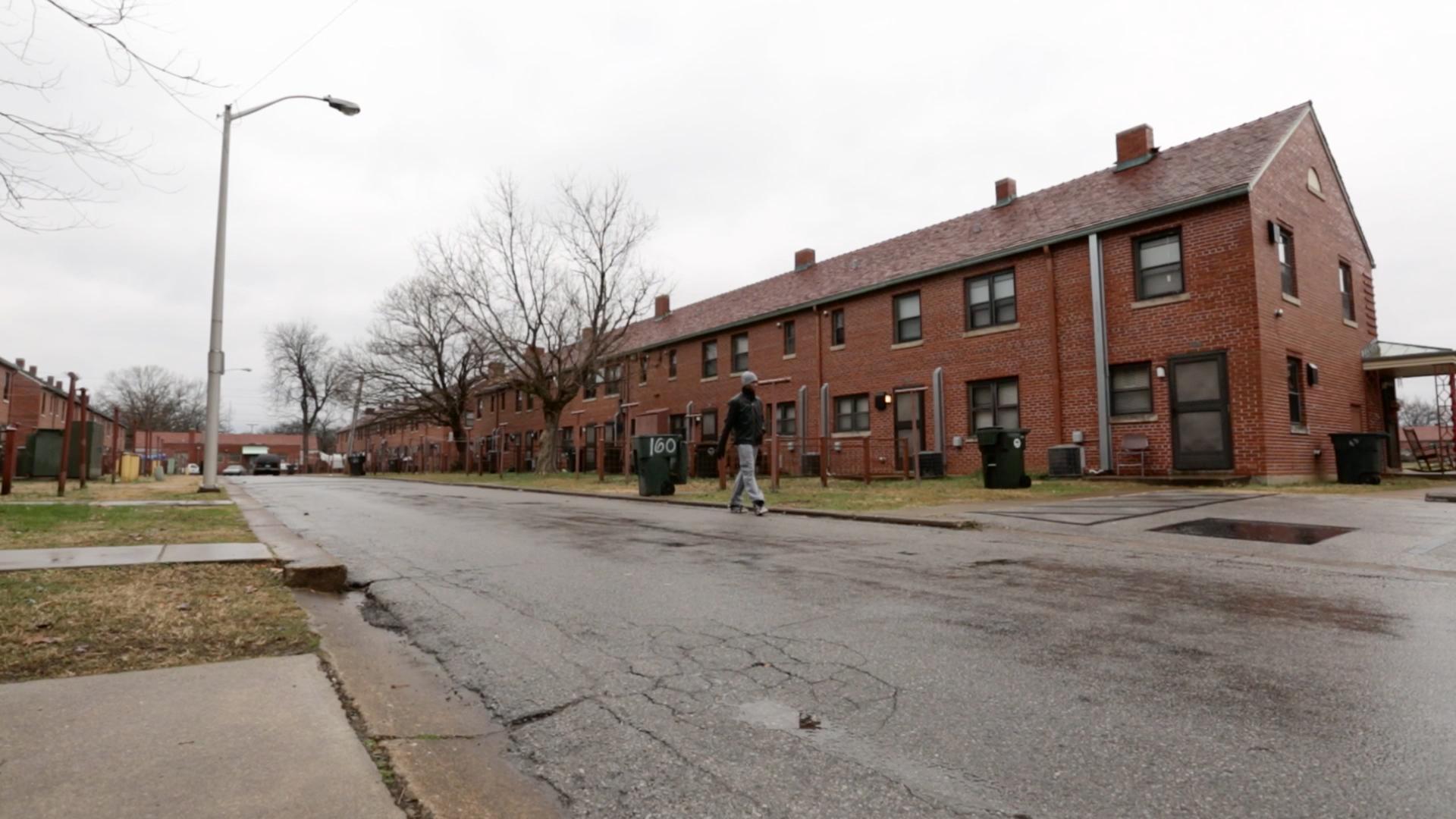 Fredrick Davis revisits East Lake Courts, the housing complex where he lived during childhood.