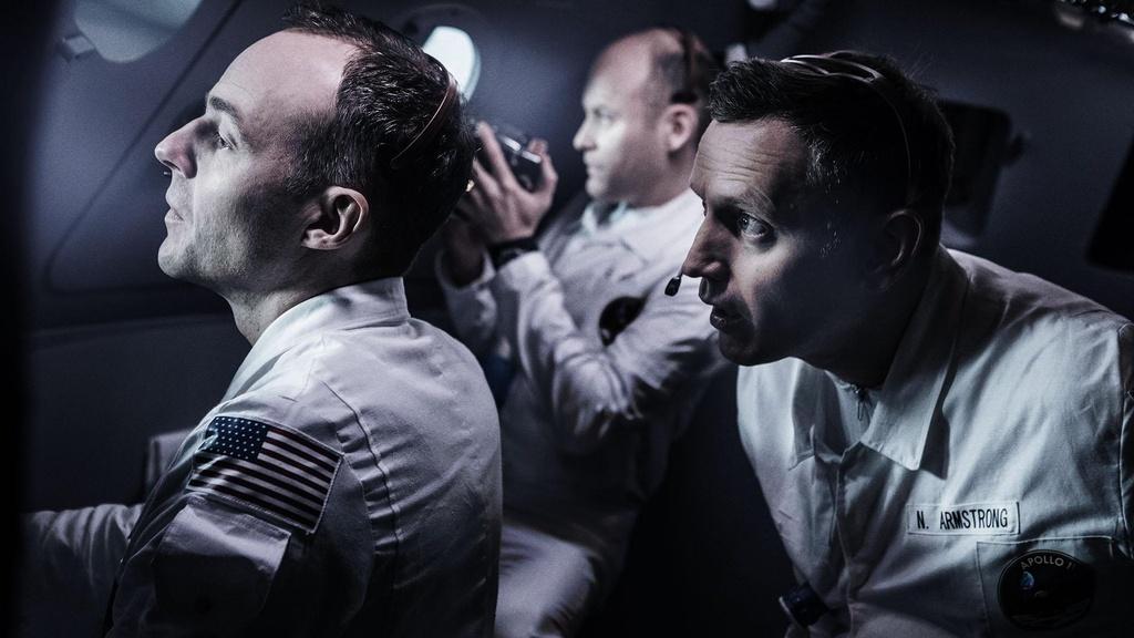 The crew of Apollo 11 looking out at the horizon.