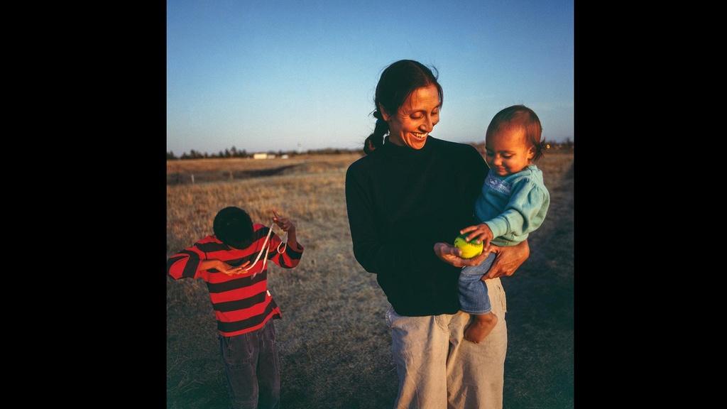 Doctor Lucy Reifel (Lakota) with daughter Emma and adopted son Casey.