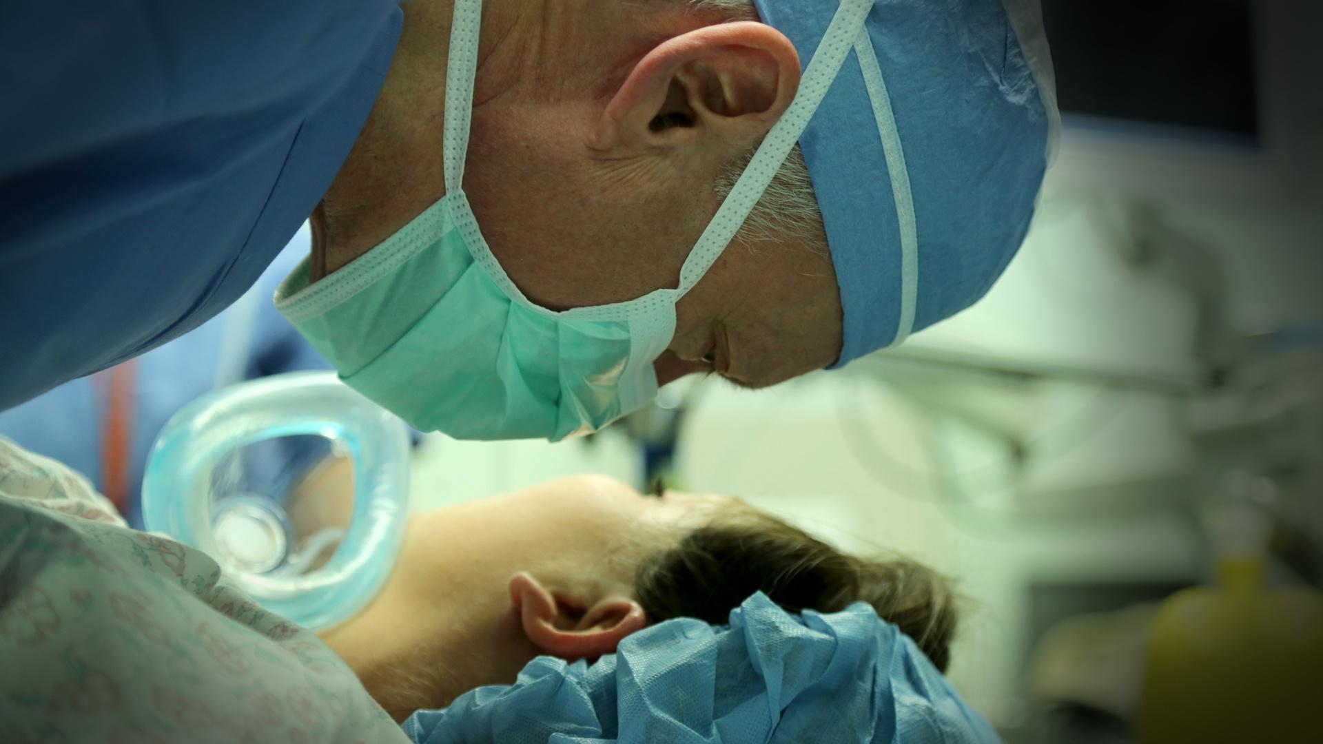 Dr. N. Scob Adzick wakes a patient after fetal surgery.