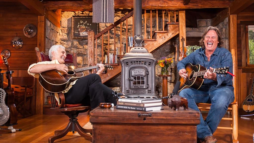 Host Verlon Thompson and Billy Dean playing guitar.