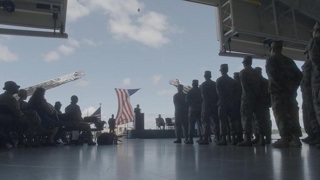 Soldiers stand at attention at a welcome-home ceremony for the Delaware National Guard.