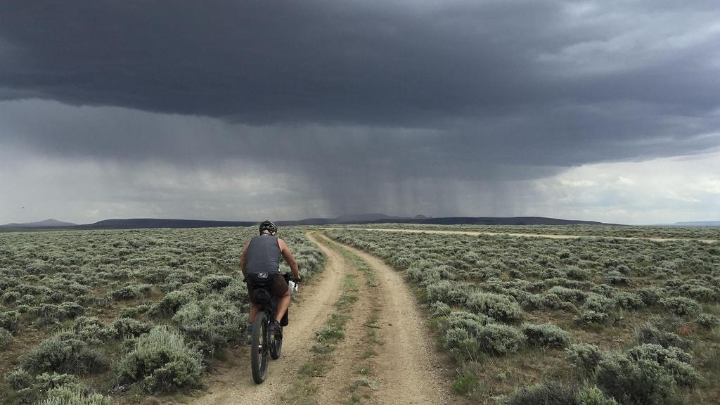 Peter Stegen riding bike in Wyoming.