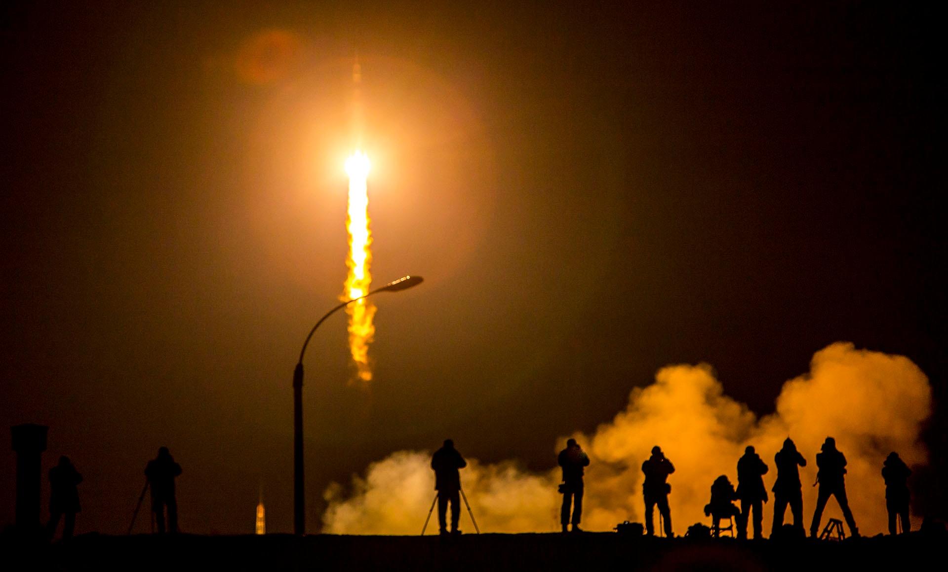 Photographers capture the moment as astronauts begin the Year in Space mission.