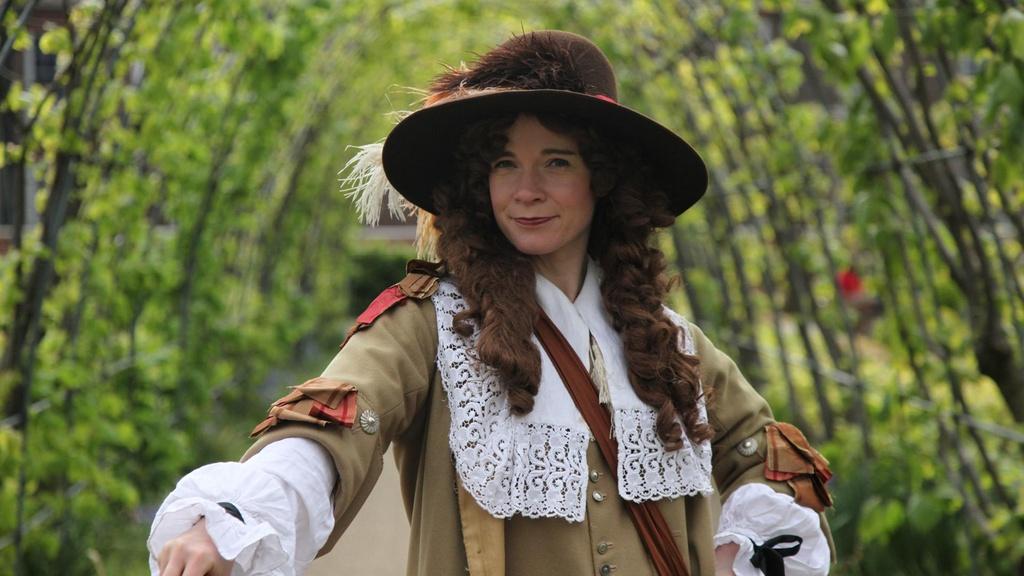 Lucy wearing a replica James II three-piece biscuit suit.