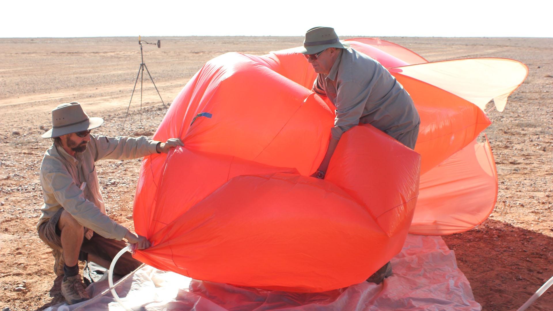 Scientist preparing balloon for the dust storm experiment.