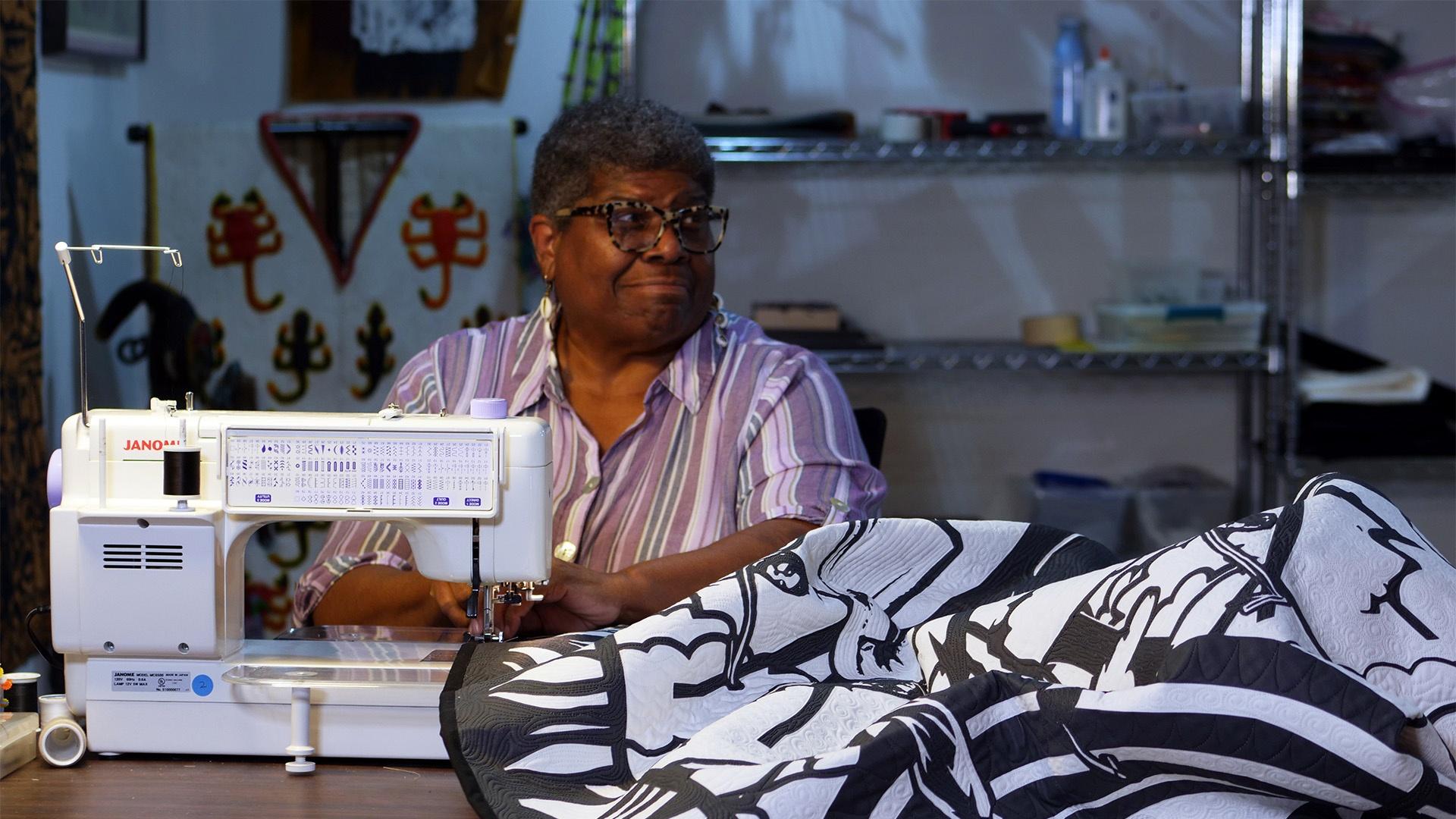 Artist Carolyn Mazloomi at the sewing machine