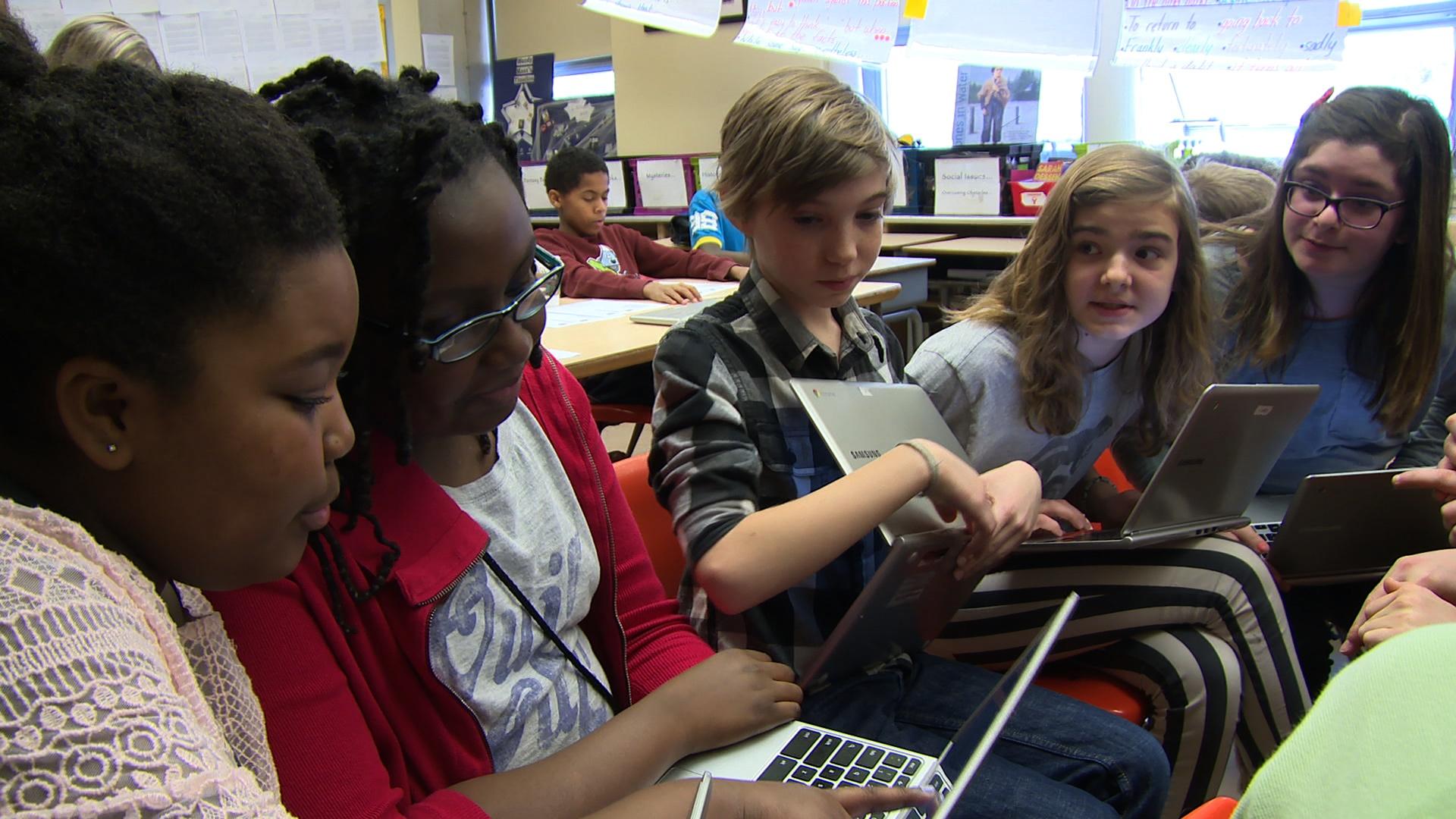 6th graders prepare their rebuttal during a virtual debate.