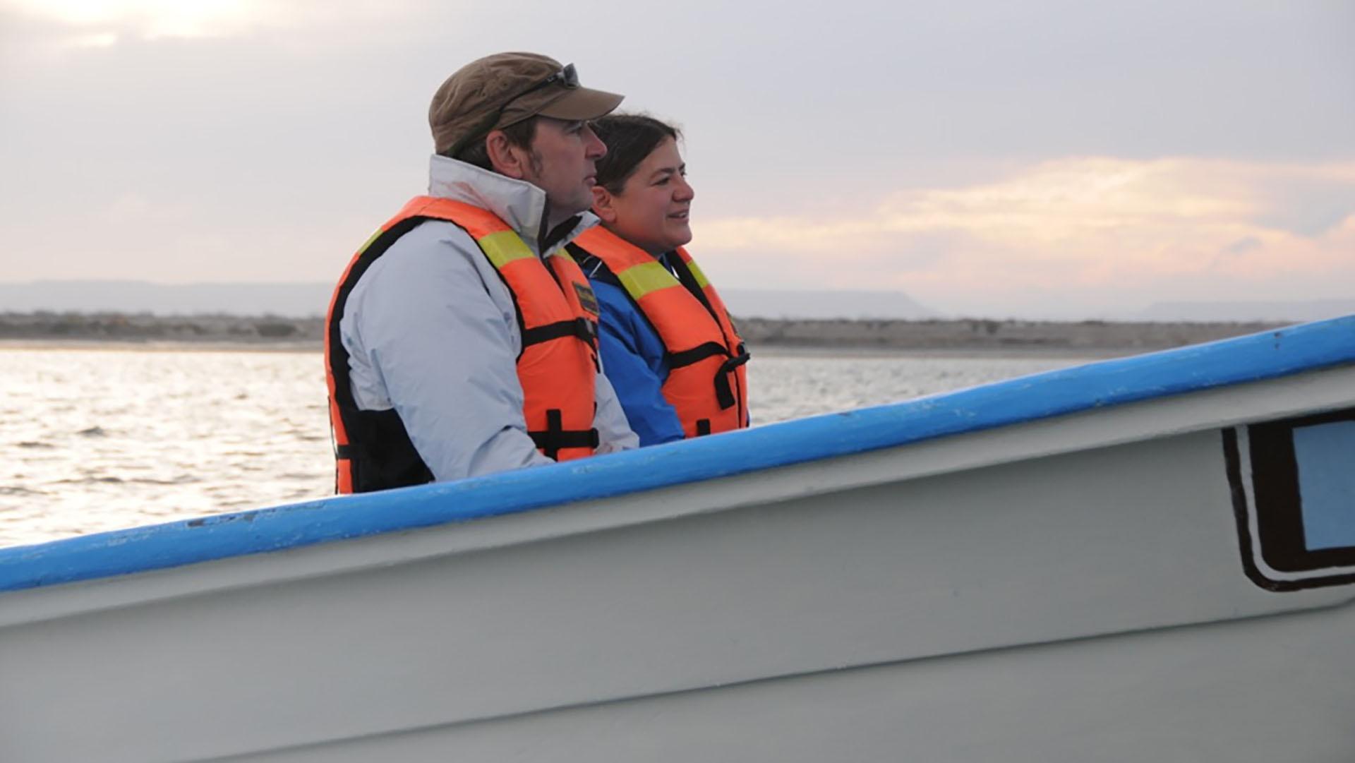 Image of man and woman on boat