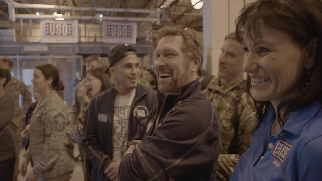 Craig Morgan, Anthony Pettis, and volunteer Tara Mogan share a laugh.