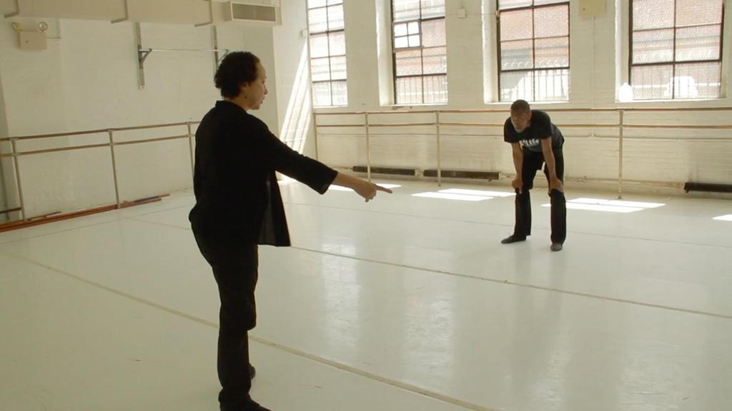 Fredrick Davis receives instruction from Virginia Johnson.
