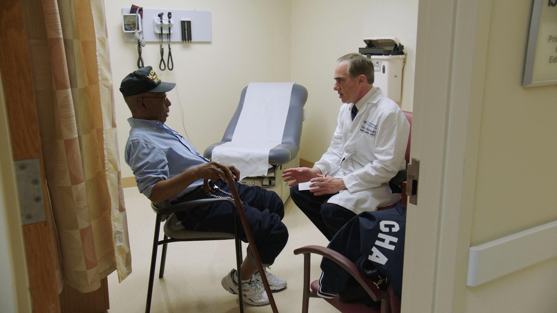 Dr. David Shulkin, Secretary of the U.S. Department of Veterans Affairs, speaks with a patient.