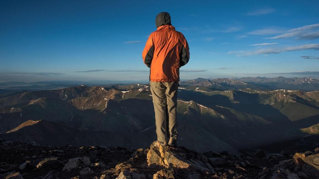 Kery Harrelson stands at the summit of Grays Peak.