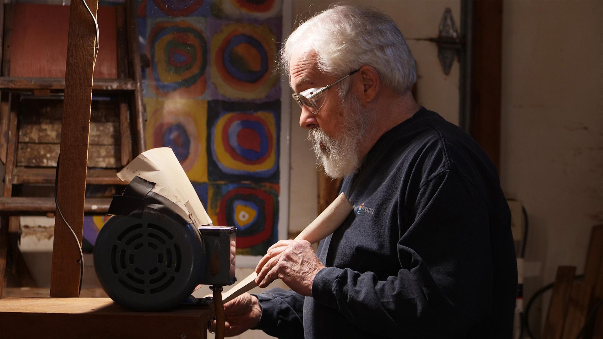 Sculptor Norm Sartorius at the sander