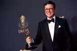 CBS says Colbert move was financial but some question timing