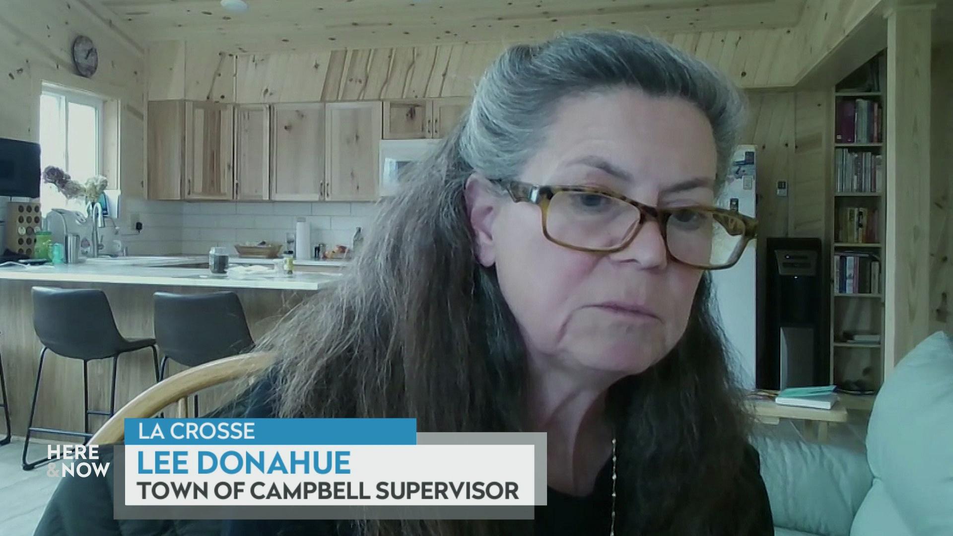 A still image from a video shows Lee Donahue seated in front of wooden cabinets and ceiling with a graphic at bottom reading 'La Crosse,' 'Lee Donahue' and 'Town of Campbell Supervisor.'