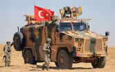 News Wrap: Turkish forces deploy to Syrian border
