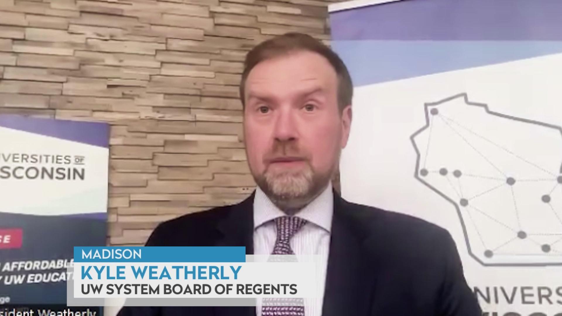 A still image shows Kyle Weatherly standing in front of a posterboard with the Universities of Wisconsin logo, with a graphic at the bottom that reads 'Madison,' 'Kyle Weatherly' and 'UW System Board of Regents.'