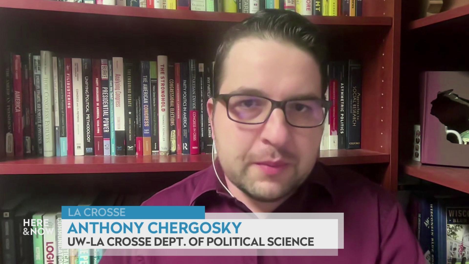A still image shows Anthony Chergosky seated in front of brown bookshelves lined with books with a graphic at bottom reading 'La Crosse,' 'Anthony Chergosky' and 'UW-La Crosse Dept. of Political Science.' A still image shows Anthony Chergosky seated in front of brown bookshelves lined with books with a graphic at bottom reading 'La Crosse,' 'Anthony Chergosky' and 'UW-La Crosse Dept. of Political Science.'