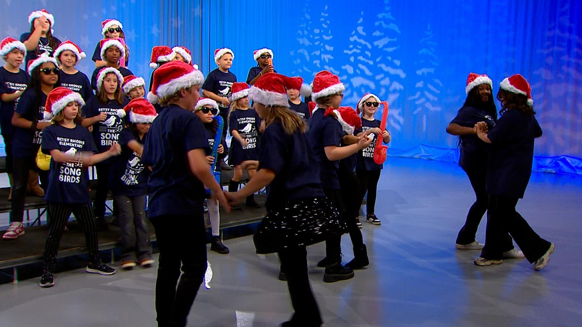 Students from Betsy A. Rhodes Elementary School perform Rockin’ Around the Christmas Tree.