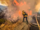 Raging Calif. wildfires strand people, prompt power outages