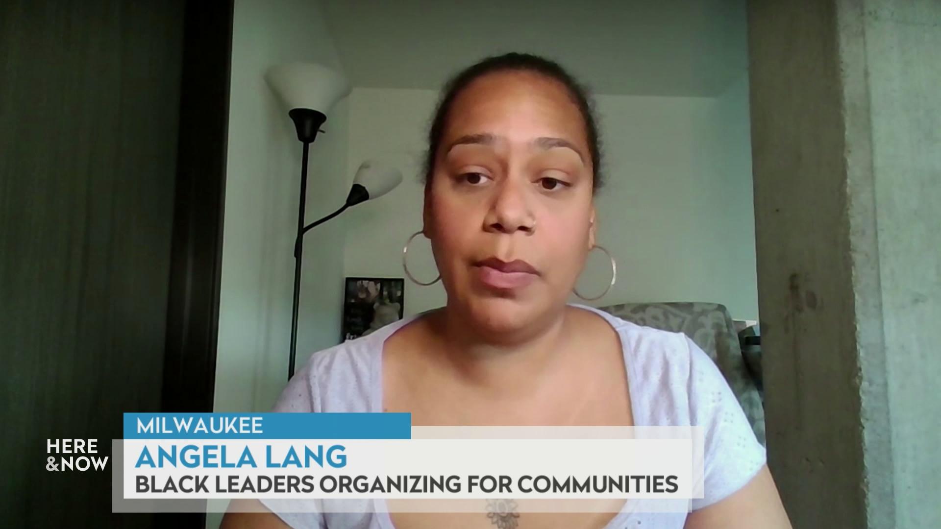 A still image from a video shows Angela Lang seated in front of a lamp with a graphic at bottom reading 'Milwaukee,' 'Angela Lang' and 'Black Leaders Organizing for Communities.'