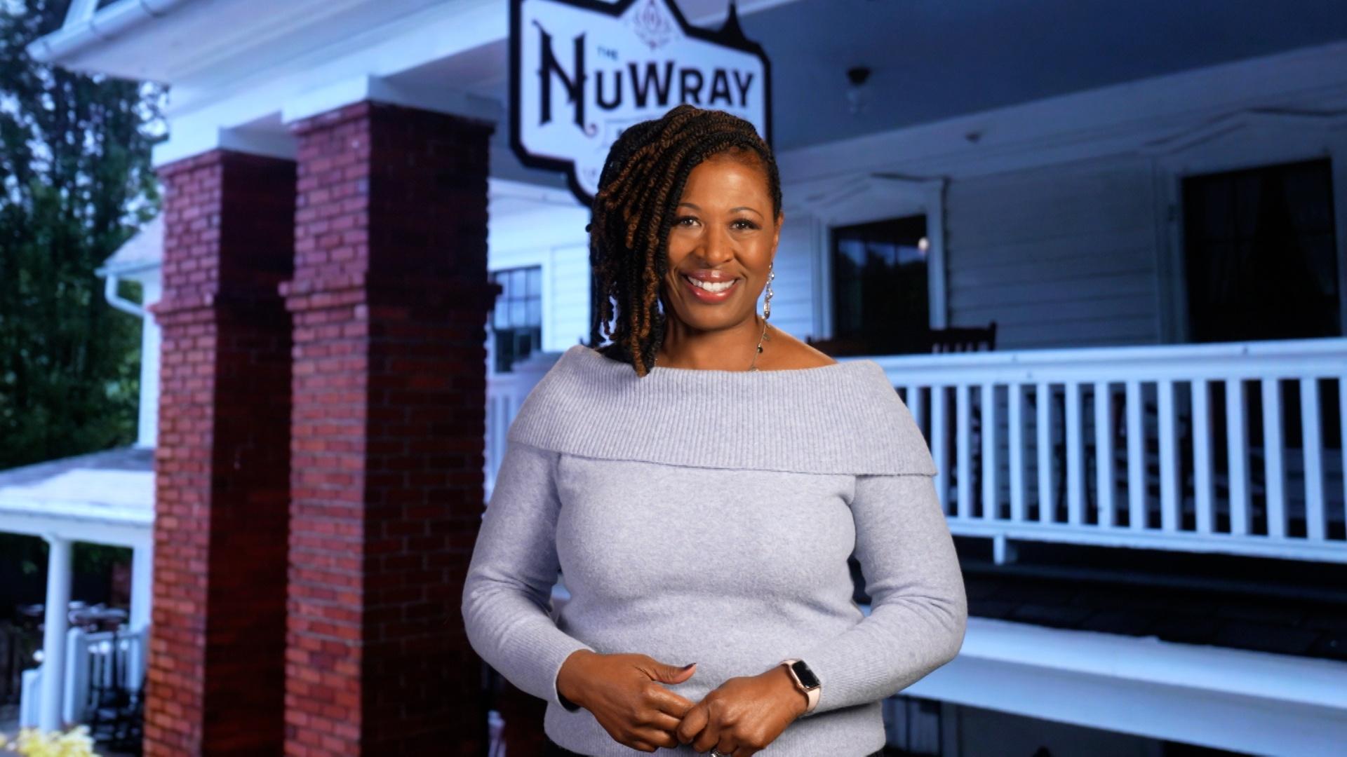 Host of NC Weekend Deborah Holt Noel in front of the NuWray Hotel.
