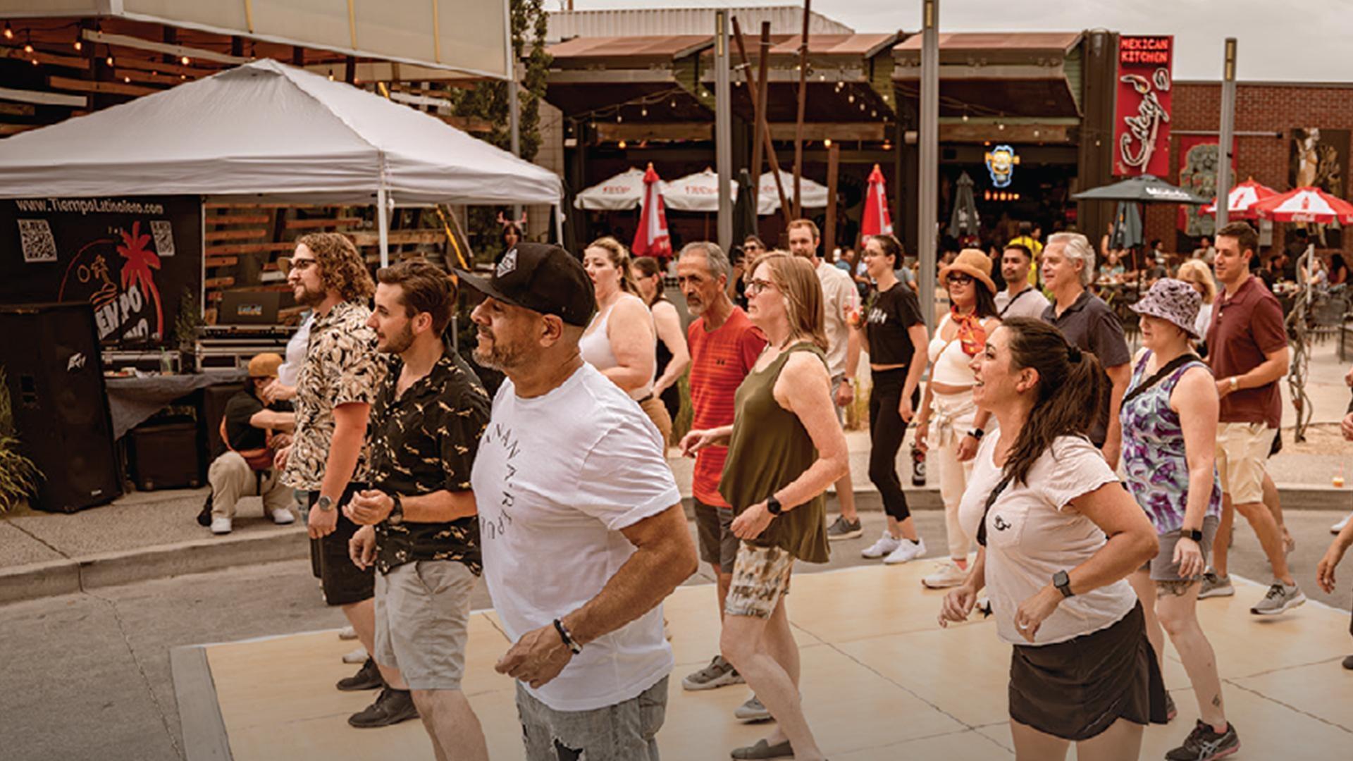 Explore Dancing in the Streets, Flamenco, Kelley Booze’s painting, and Sarah Hambly’s wearable art.